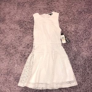 All white dress with patterned cutouts